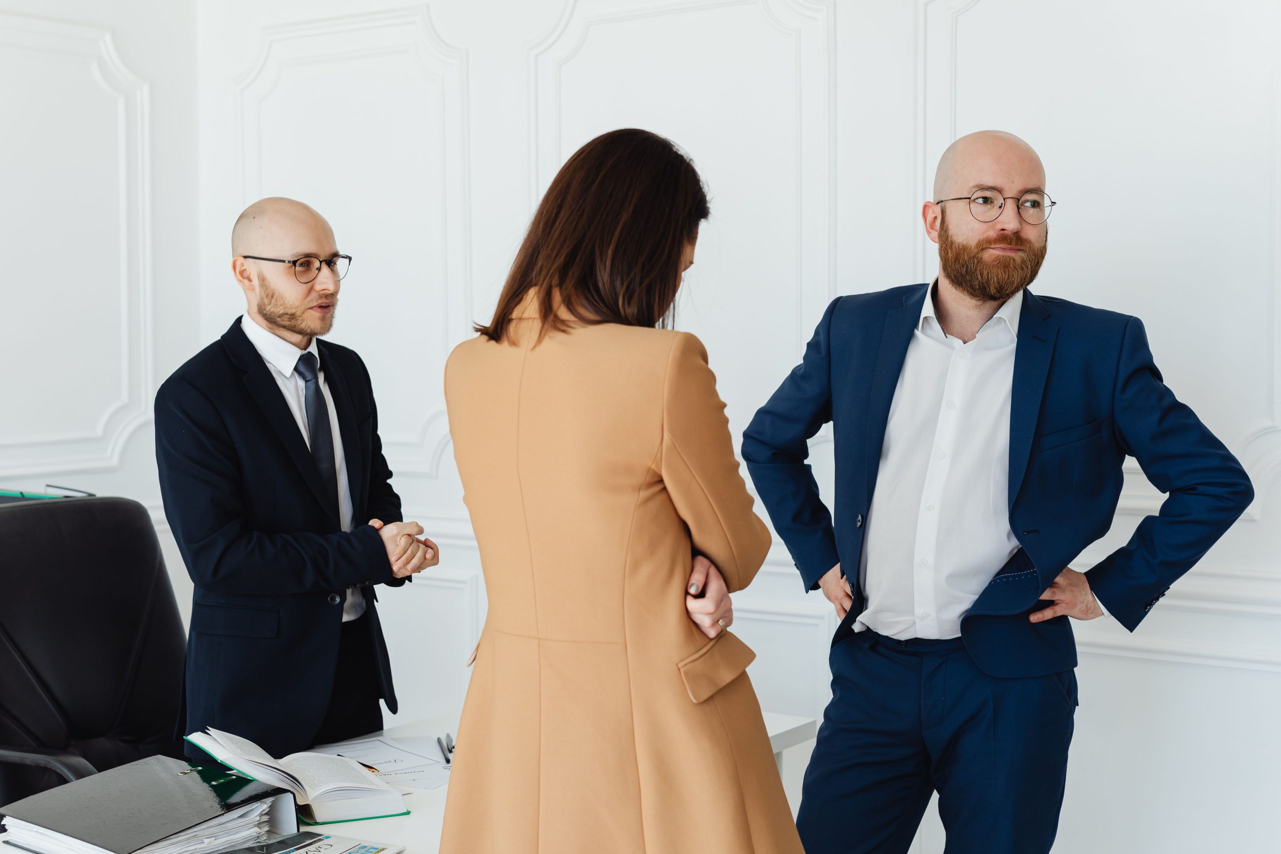 confidential-client-meeting Professionals hold a discreet business meeting in a modern office, illustrating private client consultations.