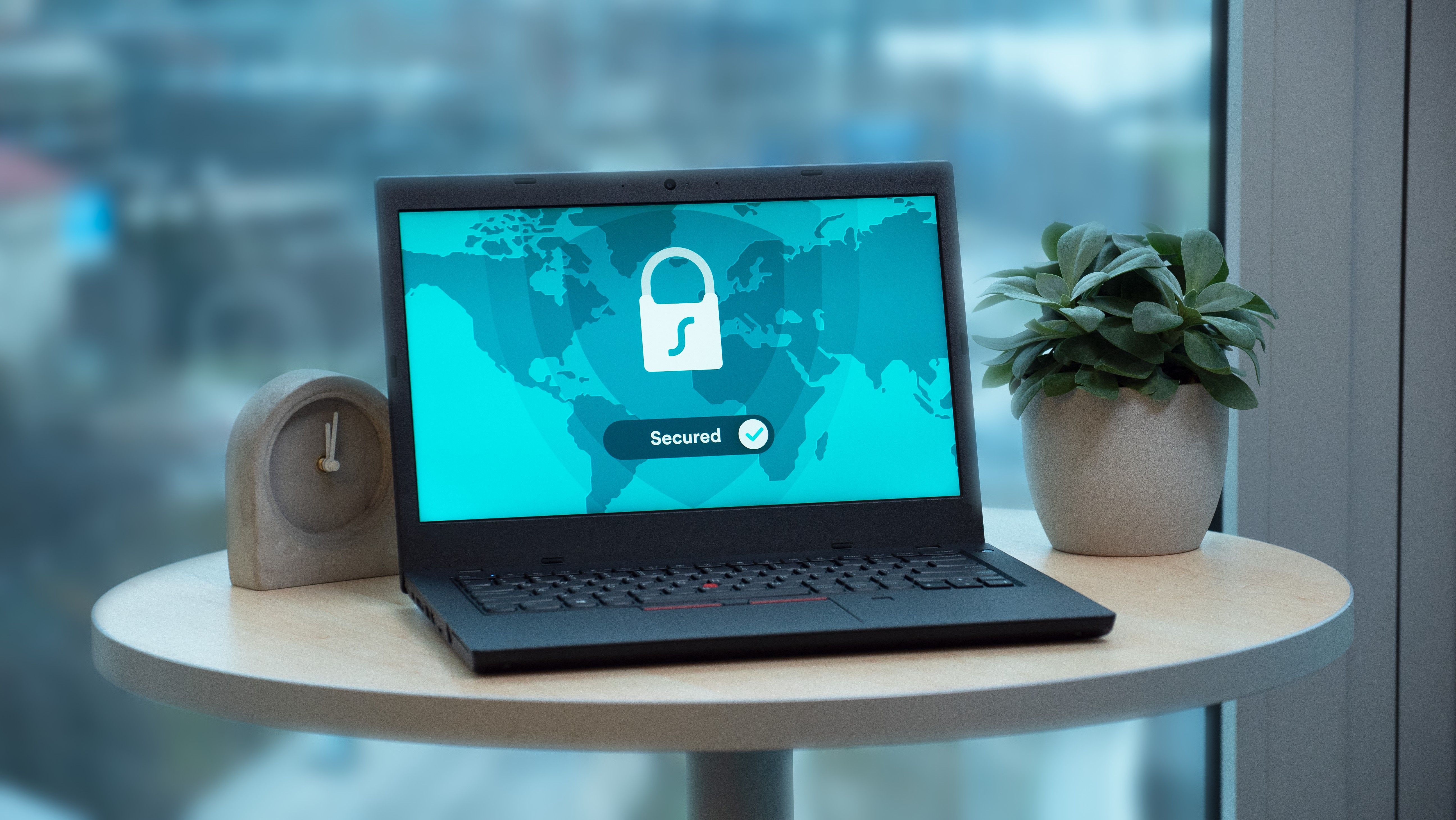 Laptop displaying a security lock icon, representing digital privacy and confidential client data protection.
